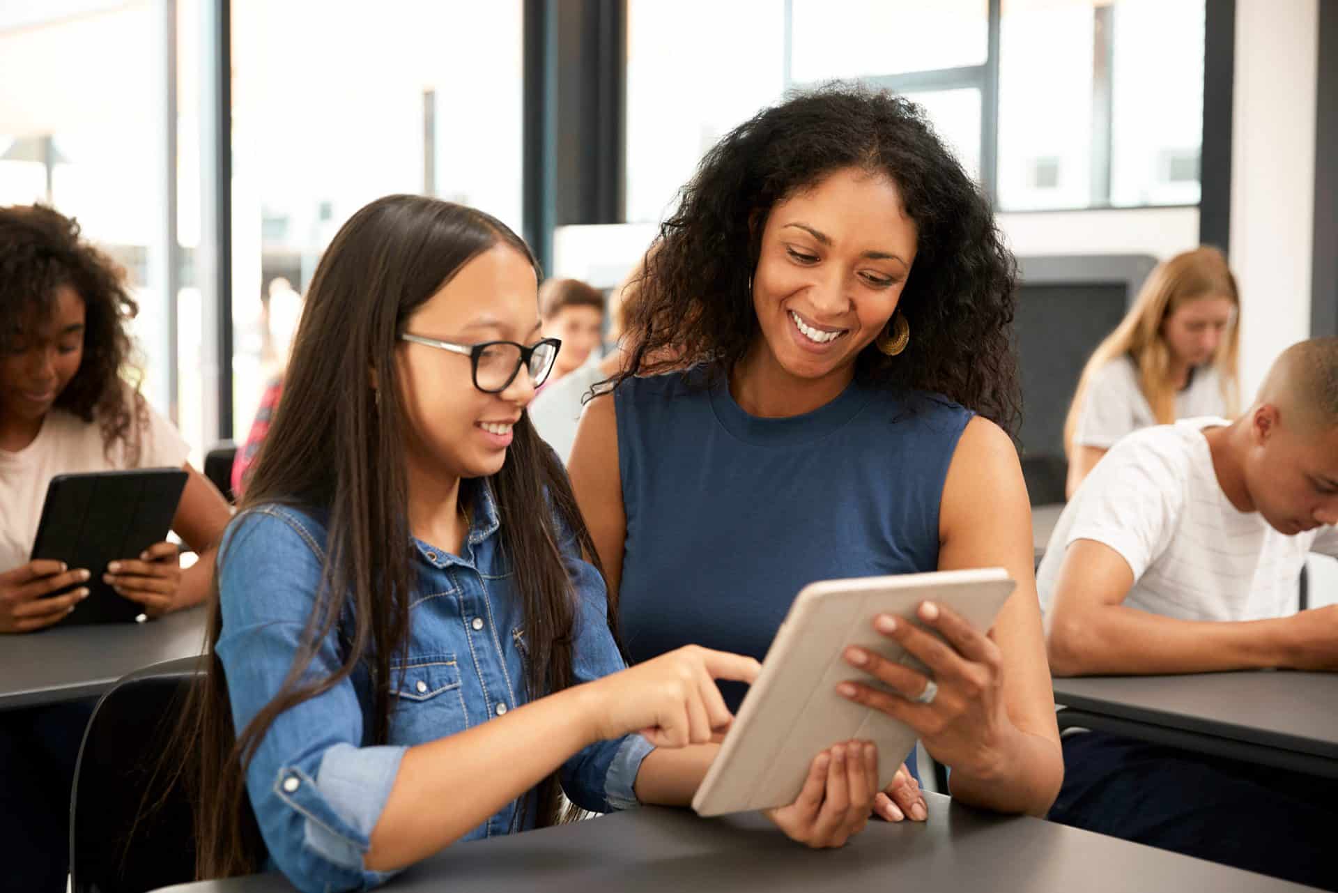 Teacher and student in classroom.