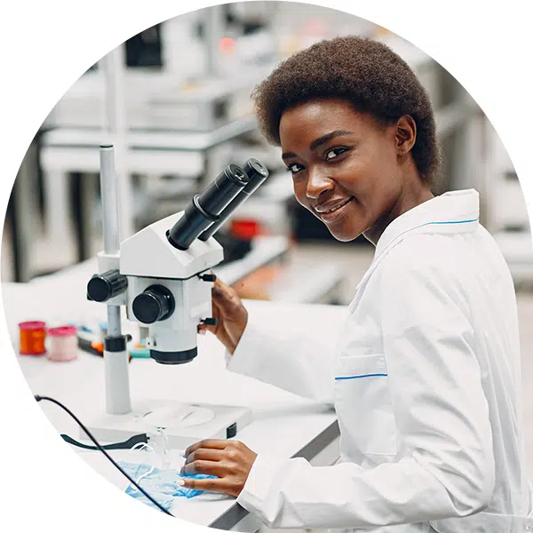 image of medical assistant health science career pathway with woman at microscope