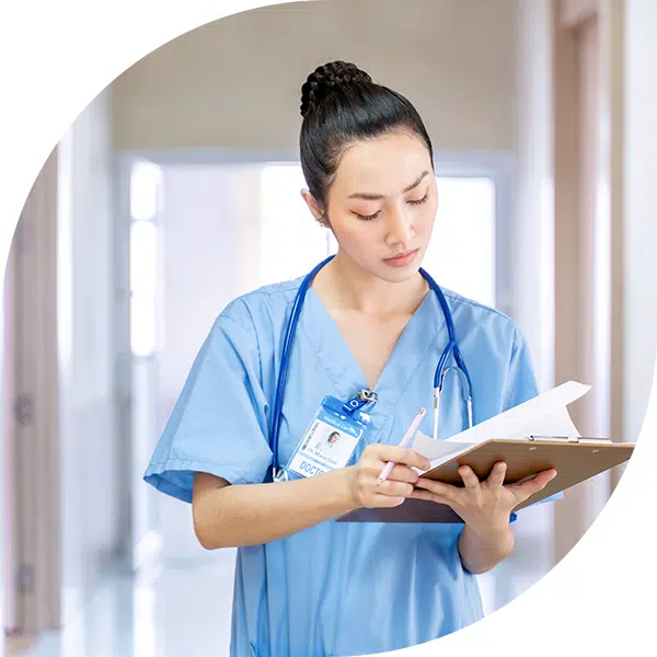 image of nurse health science career pathway with nurse reviewing chart