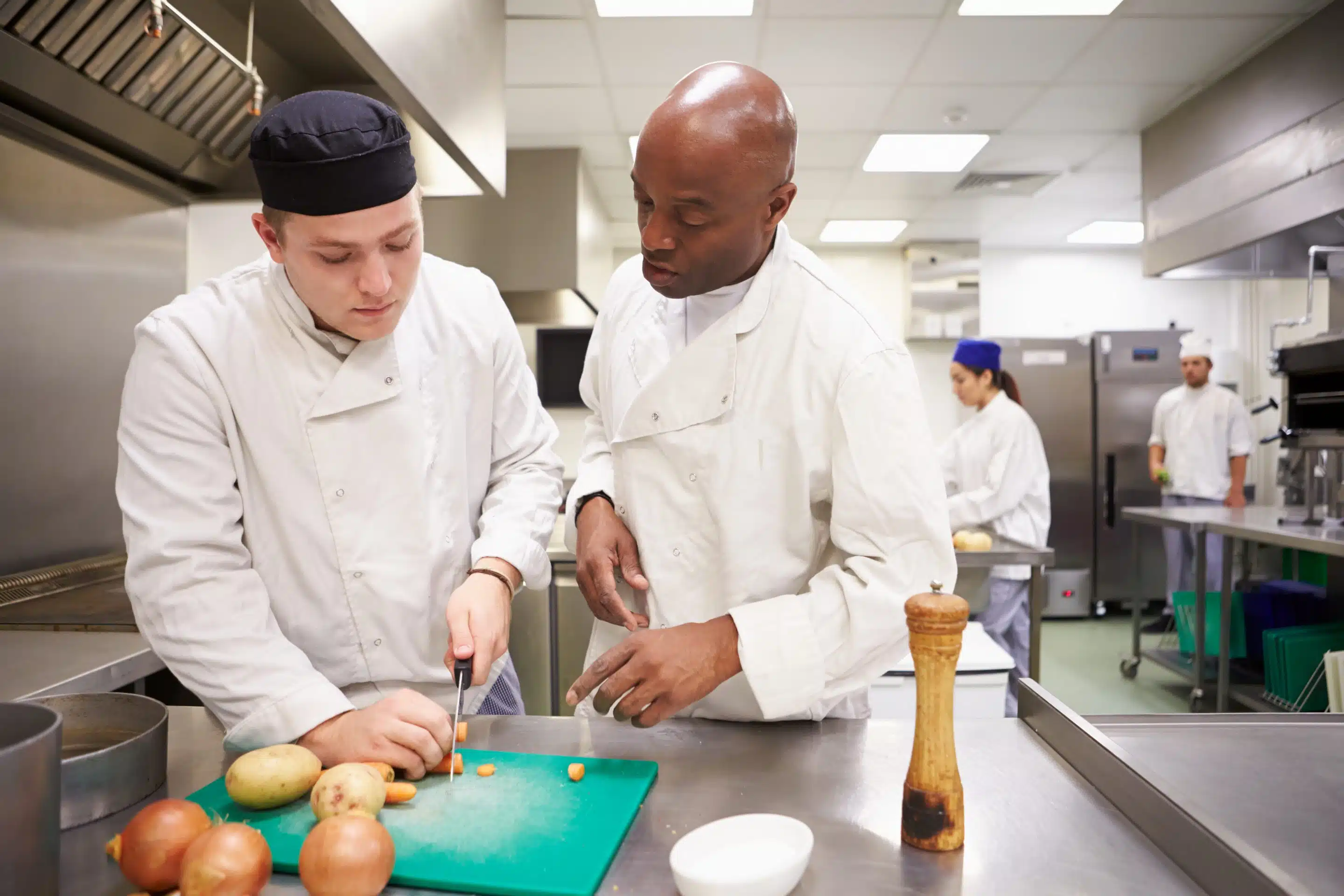 head chef helping prep food